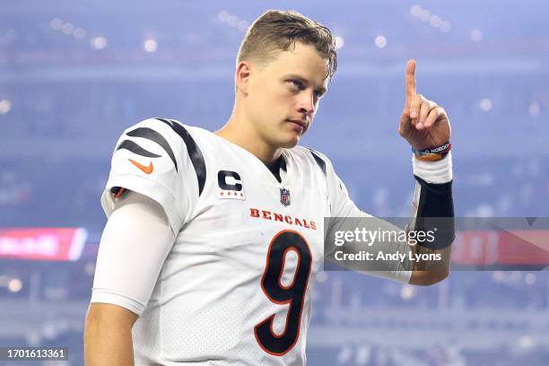 Joe Burrow of the Cincinnati Bengals celebrates as he walks off the field after defeating the Los Angeles Rams in the game at Paycor Stadium on...