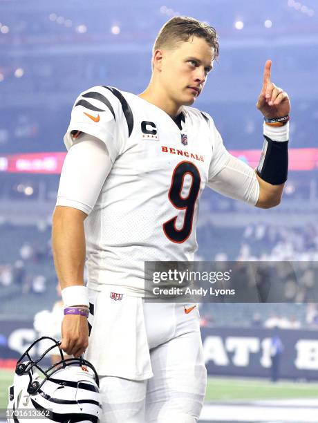 Joe Burrow of the Cincinnati Bengals celebrates as he walks off the field after defeating the Los Angeles Rams in the game at Paycor Stadium on...