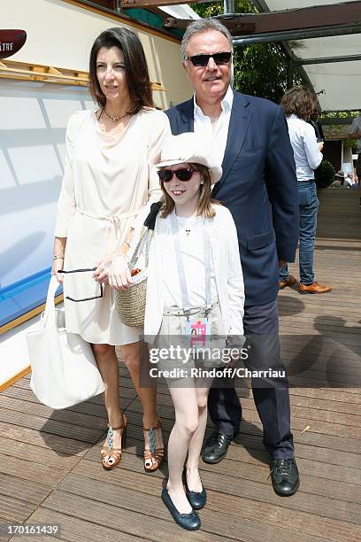 Alain Afflelou with his wife Christine and their daughter Clara sighting at Roland Garros Tennis French Open 2013 - Day 14 on June 8, 2013 in Paris,...