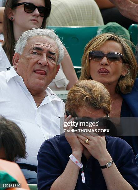 Former IMF chief Dominique Strauss-Kahn and his partner, Media Marketing Executive Myriam L'Aouffir attend the women's French tennis Open final match...
