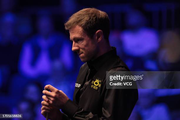 Jack Lisowski of England chalks the cue in the first round match against Joe O'Connor of England on day one of the 2023 Cazoo British Open at the...