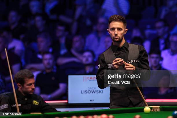 Joe O'Connor of England chalks the cue in the first round match against Jack Lisowski of England on day one of the 2023 Cazoo British Open at the...