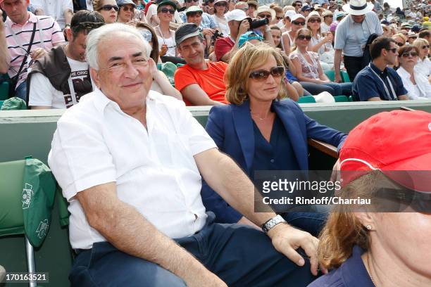 Dominique Strauss-Kahn and Myriam L'Aouffir sighting at Roland Garros Tennis French Open 2013 - Day 14 on June 8, 2013 in Paris, France.