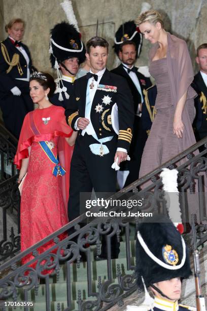 Princess Mary of Denmark, Crown Prince Frederik of Denmark and Princess Charlene of Monaco depart from the wedding ceremony of Princess Madeleine of...