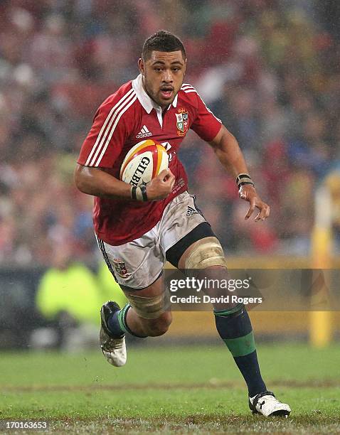 Toby Faletau of the Lions runs with the ball during the match between the Queensland Reds and the British & Irish Lions at Suncorp Stadium on June 8,...