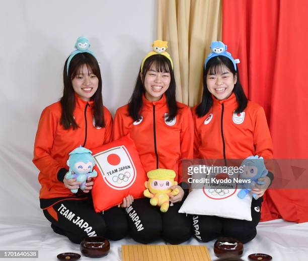Members of Japan's women's go team Rina Fujisawa, Asami Ueno and Risa Ueno take part in a photo shoot for the Japanese Olympic Committee's social...