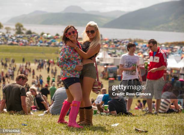 Music fans enjoy the sun on day 2 of the Rockness festival at Clune Farm, Loch Ness on June 9, 2013 in Inverness, Scotland.