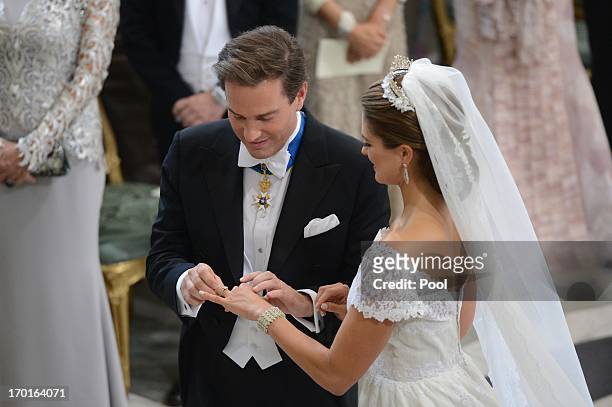 Princess Madeleine of Sweden and Christopher O'Neill exchange rings during the wedding ceremony of Princess Madeleine of Sweden and Christopher...