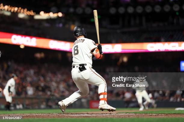 Michael Conforto of the San Francisco Giants hits a single that scored two runs against the San Diego Padres in the eighth inning at Oracle Park on...