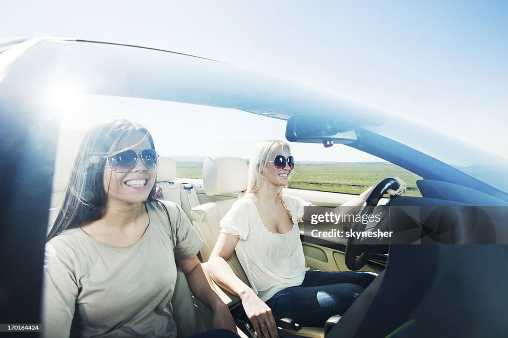 Convertible Car Ride Two Women Enjoying In A Convertible Car Ride High-Res Stock Photo ...