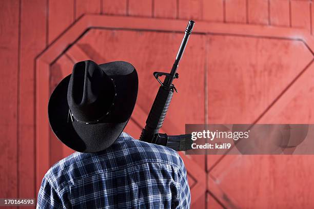 man holding rifle - ar 15 stock pictures, royalty-free photos & images