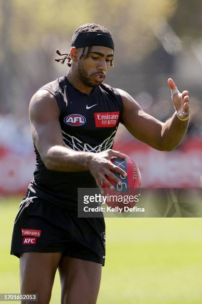 Isaac Quaynor of the Magpies kicks the ball during a Collingwood Magpies AFL training session at AIA Centre on September 26, 2023 in Melbourne,...