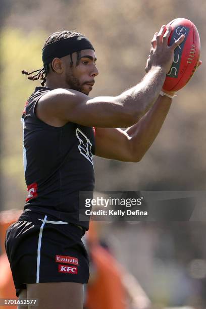 Isaac Quaynor of the Magpies marks the ball during a Collingwood Magpies AFL training session at AIA Centre on September 26, 2023 in Melbourne,...