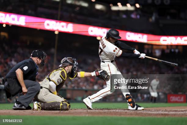 Marco Luciano of the San Francisco Giants hits a double against the San Diego Padres in the eighth inning at Oracle Park on September 25, 2023 in San...