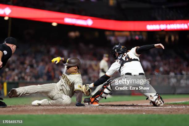 Juan Soto of the San Diego Padres is tagged out by Patrick Bailey of the San Francisco Giants in the ninth inning at Oracle Park on September 25,...