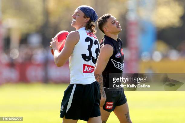 Jack Ginnivan of the Magpies and Bobby Hill of the Magpies react during a Collingwood Magpies AFL training session at AIA Centre on September 26,...