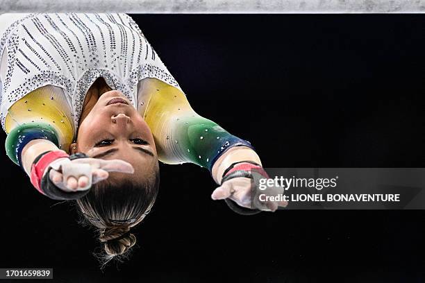 Brasil's Flavia Saraiva competes on the uneven bars during the women's qualifying session the 52nd FIG Artistic Gymnastics World Championships, in...