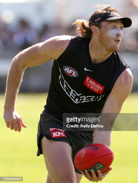 Nathan Murphy of the Magpies handballs during a Collingwood Magpies AFL training session at AIA Centre on September 26, 2023 in Melbourne, Australia.