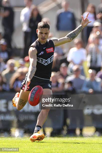 Bobby Hill of the Magpies kicks the ball during a Collingwood Magpies AFL training session at AIA Centre on September 26, 2023 in Melbourne,...
