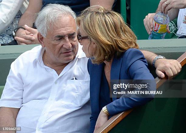 Former IMF chief Dominique Strauss Kahn and his partner Media Marketing Executive Myriam L'Aouffir attend the 2013 French tennis Open women's final...