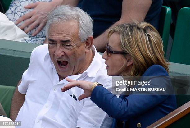 Former IMF chief Dominique Strauss Kahn and his partner Media Marketing Executive Myriam L'Aouffir attend the 2013 French tennis Open women's final...