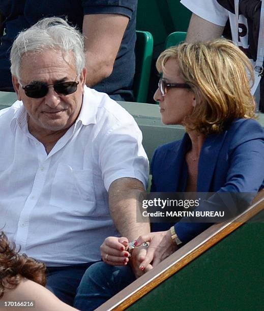 Former IMF chief Dominique Strauss Kahn and his partner Media Marketing Executive Myriam L'Aouffir attend the 2013 French tennis Open women's final...