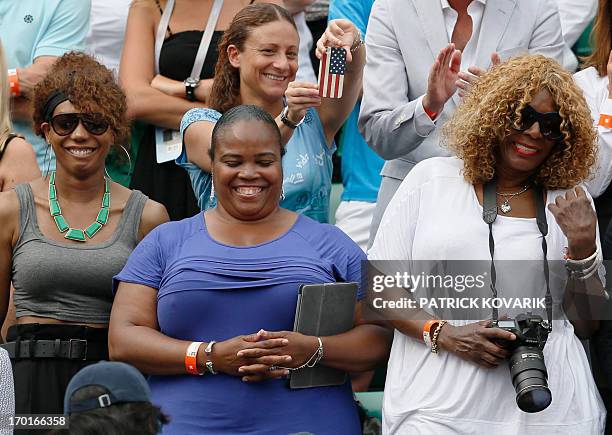 Serena Williams' sisters Venus, half sister Isha Price and their mother Oracene Price, react as Serena won the 2013 French tennis Open final at the...