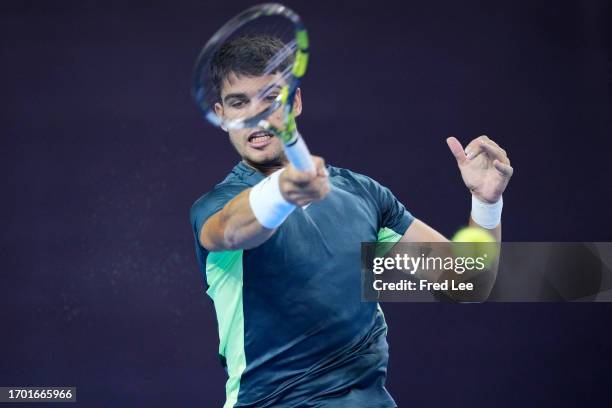 Carlos Alcaraz of Spain in action against Casper Ruud of Norway during day 7 of the 2023 China Open at National Tennis Center on October 2, 2023 in...