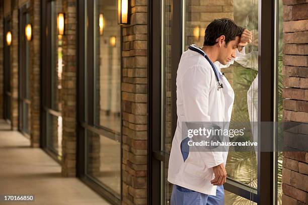 doctor in deep thought - medical mistake stock pictures, royalty-free photos & images
