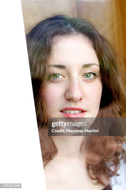 teenage looking through window - green eyes stock pictures, royalty-free photos & images
