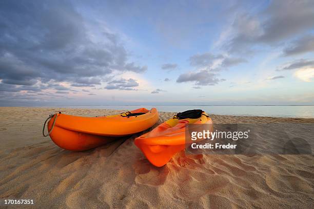 kayaks on beach - cook islands stock pictures, royalty-free photos & images