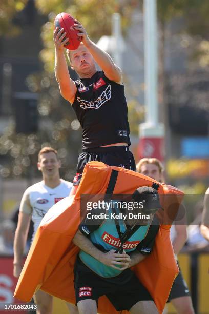 Billy Frampton of the Magpies marks the ball during a Collingwood Magpies AFL training session at AIA Centre on September 26, 2023 in Melbourne,...