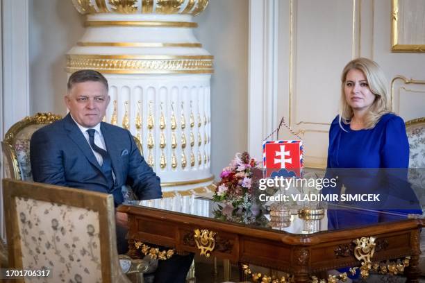 Slovak President Zuzana Caputova sits with the Chairman of Smer-Social Democracy party Robert Fico during a meeting to hand him the political mandate...