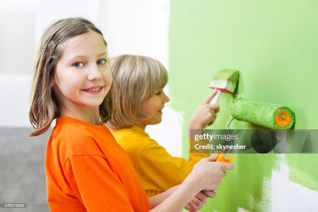 Children painting the wall