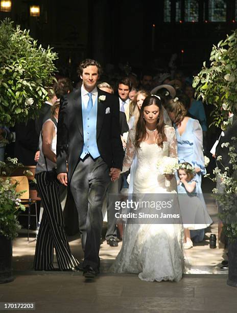 Rupert Finch and Natasha Rufus leave the church after their wedding on June 8, 2013 in Gloucester, England.