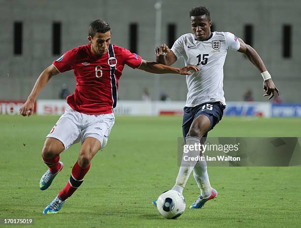 Omar Elabdellaoui of Norway tries to tackle Wilfried Zaha of England during the UEFA European U21 Championships, Group A between England and Norway...