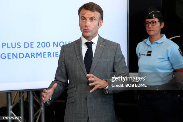 France's President Emmanuel Macron addresses the audience as he inaugurates a Gendarmerie brigade in Tonneins, southwestern France on October 2...