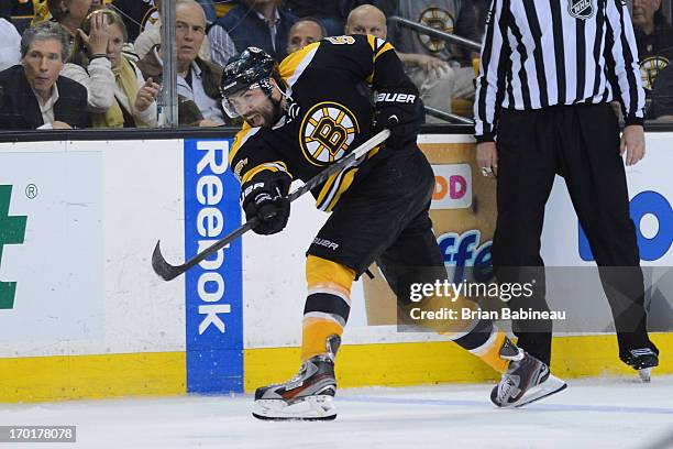 Johnny Boychuk of the Boston Bruins shoots the puck against the Pittsburgh Penguins in Game Four of the Eastern Conference Final during the 2013 NHL...