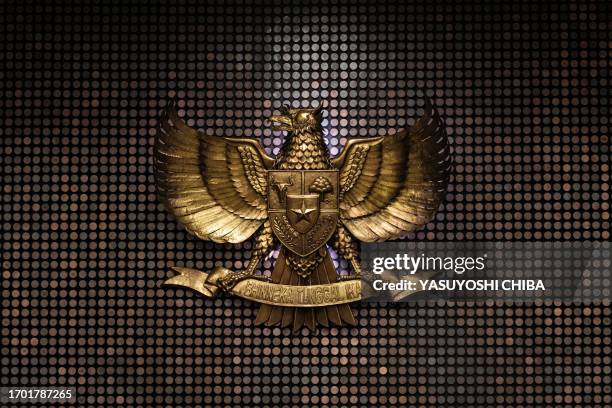 The national emblem of Indonesia, Garuda Pancasila, is seen on the wall of the Constitutional Court of Indonesia, in Jakarta on October 2, 2023.