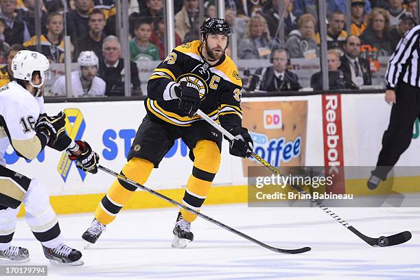 Zdeno Chara of the Boston Bruins passes the puck against the Pittsburgh Penguins in Game Four of the Eastern Conference Final during the 2013 NHL...