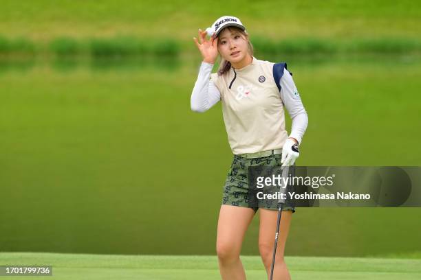 Amateur Reika Miyako of Japan acknowledges the gallery after holing out on the 18th green during the first round of Sky Ladies ABC Cup at ABC Golf...