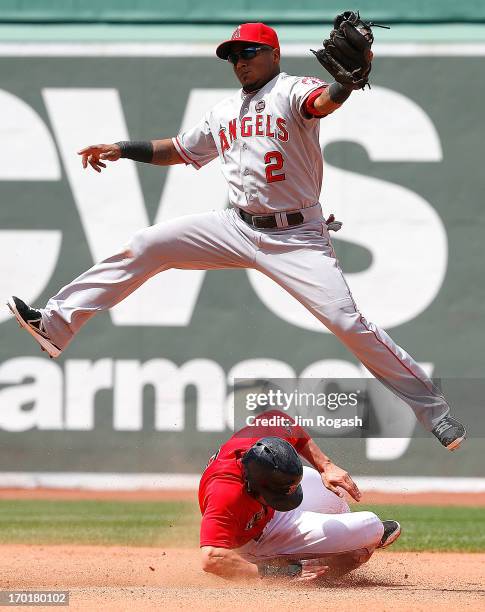 Jacoby Ellsbury of the Boston Red Sox steals second as Erick Aybar of the Los Angeles Angels of Anaheim leaps for a high throw in the 4th inning...