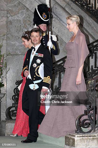 Princess Mary of Denmark, Crown Prince Frederik of Denmark and Princess Charlene of Monaco depart from the wedding of Princess Madeleine of Sweden...