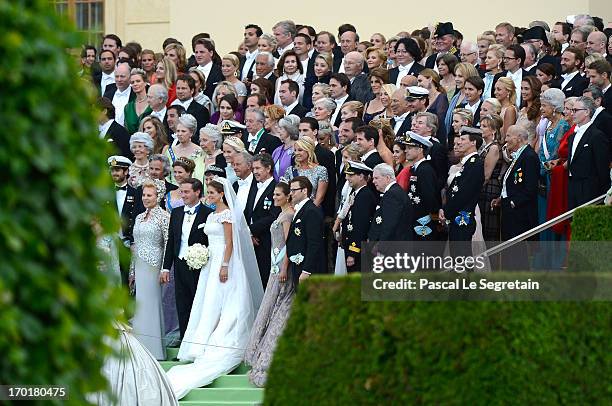 Group picture of Princess Madeleine of Sweden, Christopher O'Neill and the guests as they attend the evening banquet after the wedding of Princess...
