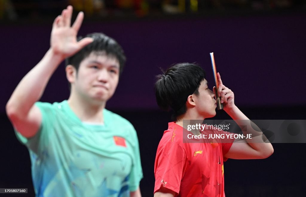 Hangzhou Racket TOPSHOT - China's Wang Chuqin kisses his racket as he celebrates his ...