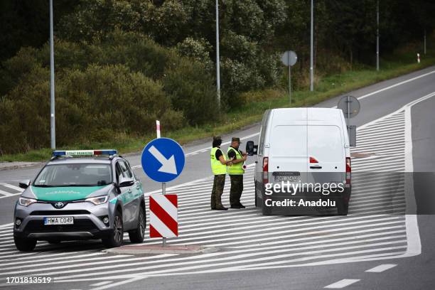 Polish Border Guard check passport and ID cards on the border with Slovakia in Chyzne, Poland on October 2, 2023. Polish government introduced checks...