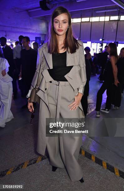 Kristina Romanova attends the Sacai Womenswear Spring/Summer 2024 show on October 2, 2023 in Paris, France.