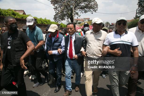 Former President of Madagascar and presidential candidate Marc Ravalomanana marches towards the city center accompanied by his supporters in...