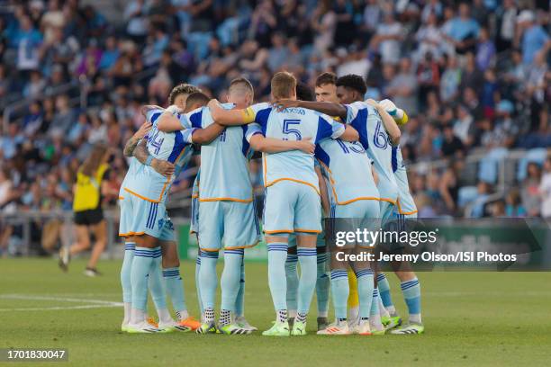 Colorado Rapids players huddle on the field before a game between Colorado Rapids and Minnesota United FC at Allianz Field on August 30, 2023 in St....