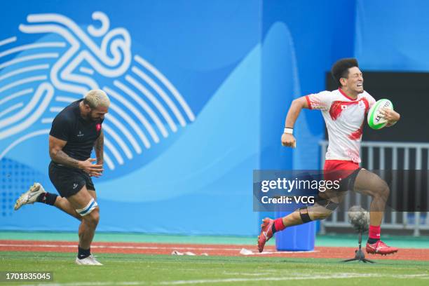 Team Japan competes against Team Hong Kong in the Rugby Sevens - Men's Semifinal on day three of the 19th Asian Games at Hangzhou Normal University...